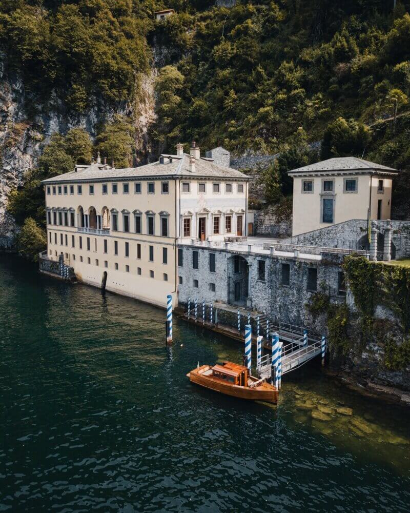 Historic architecture and mountain backdrop at Villa Pliniana